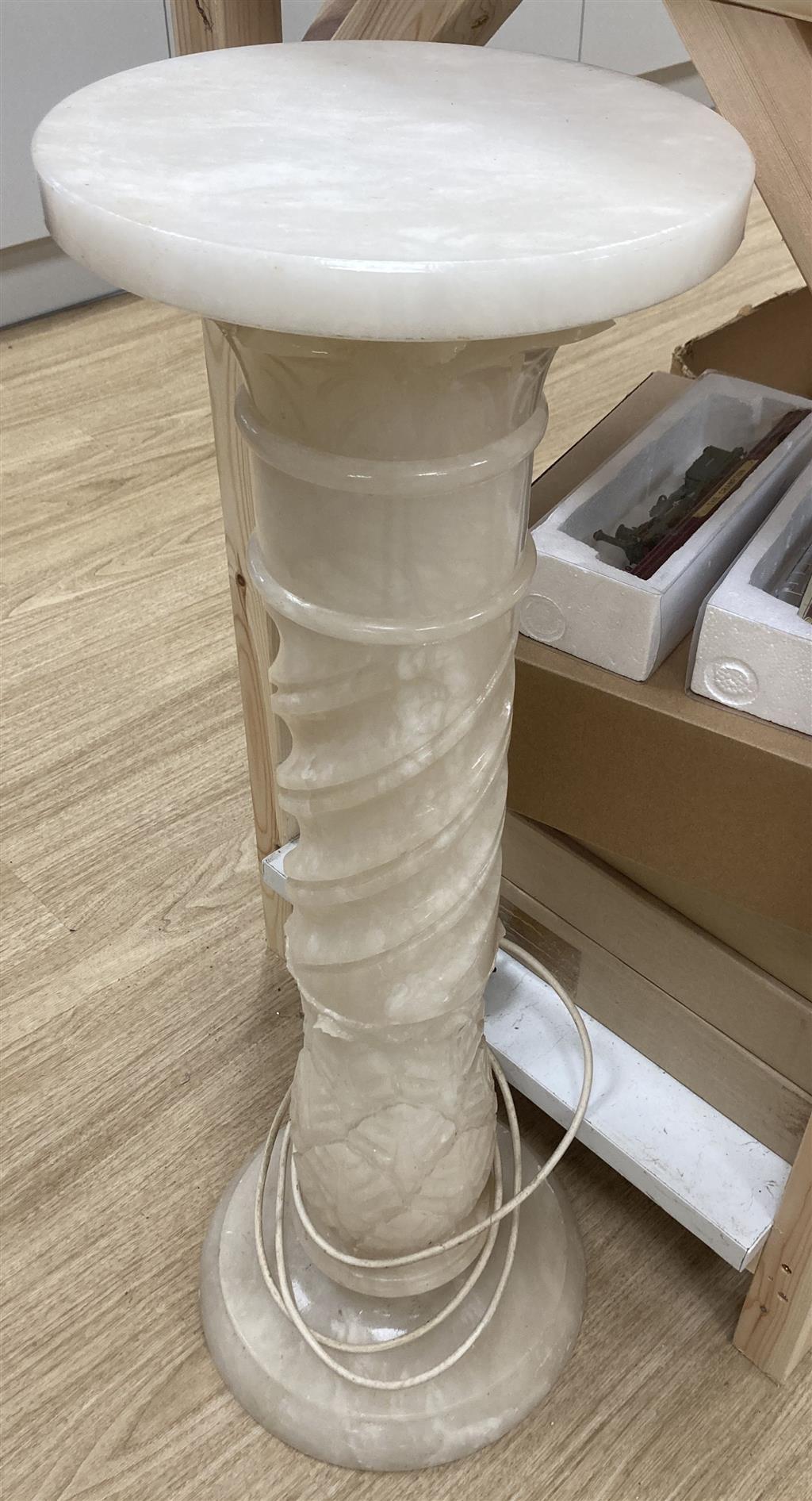 A white carved alabaster pedestal, 80cm high